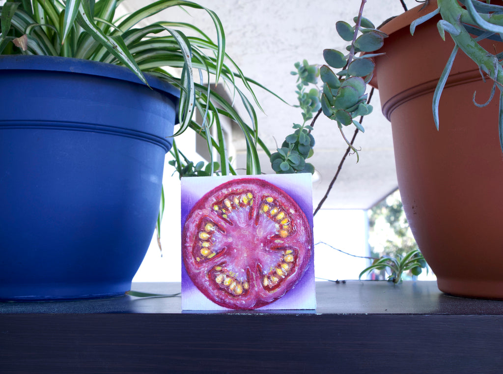 Tomato with purple background